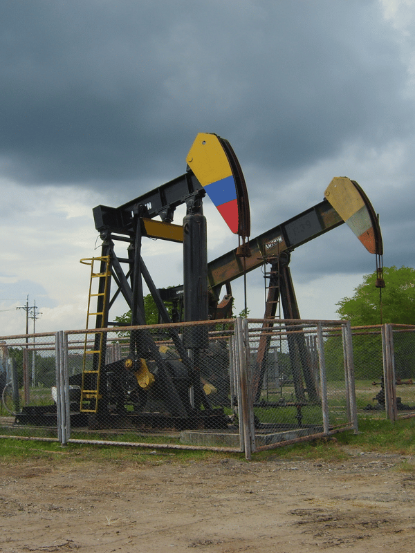 Pump jack painted in the colors of the Colombian flag