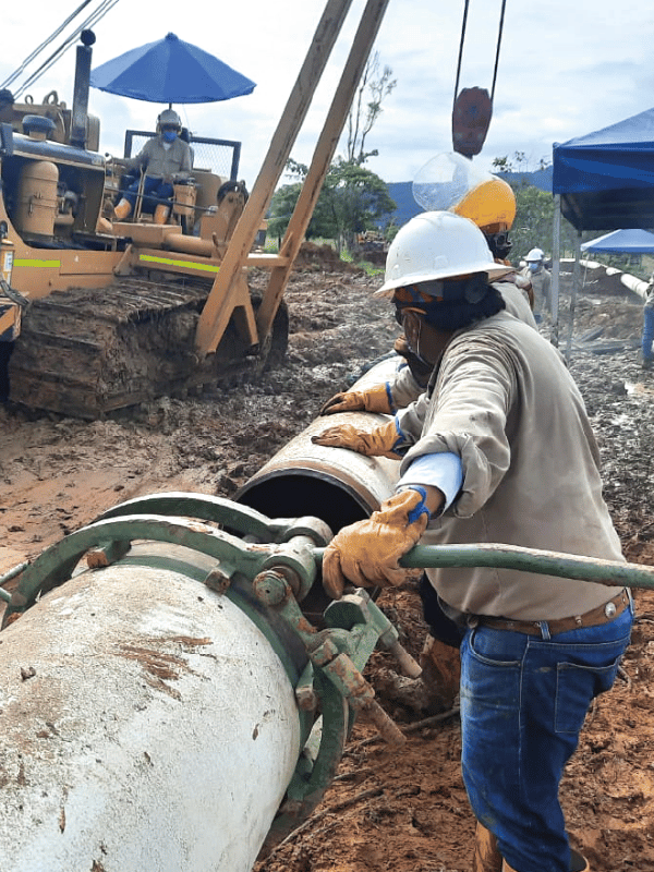Worker carrying out maintenance on a pipeline
